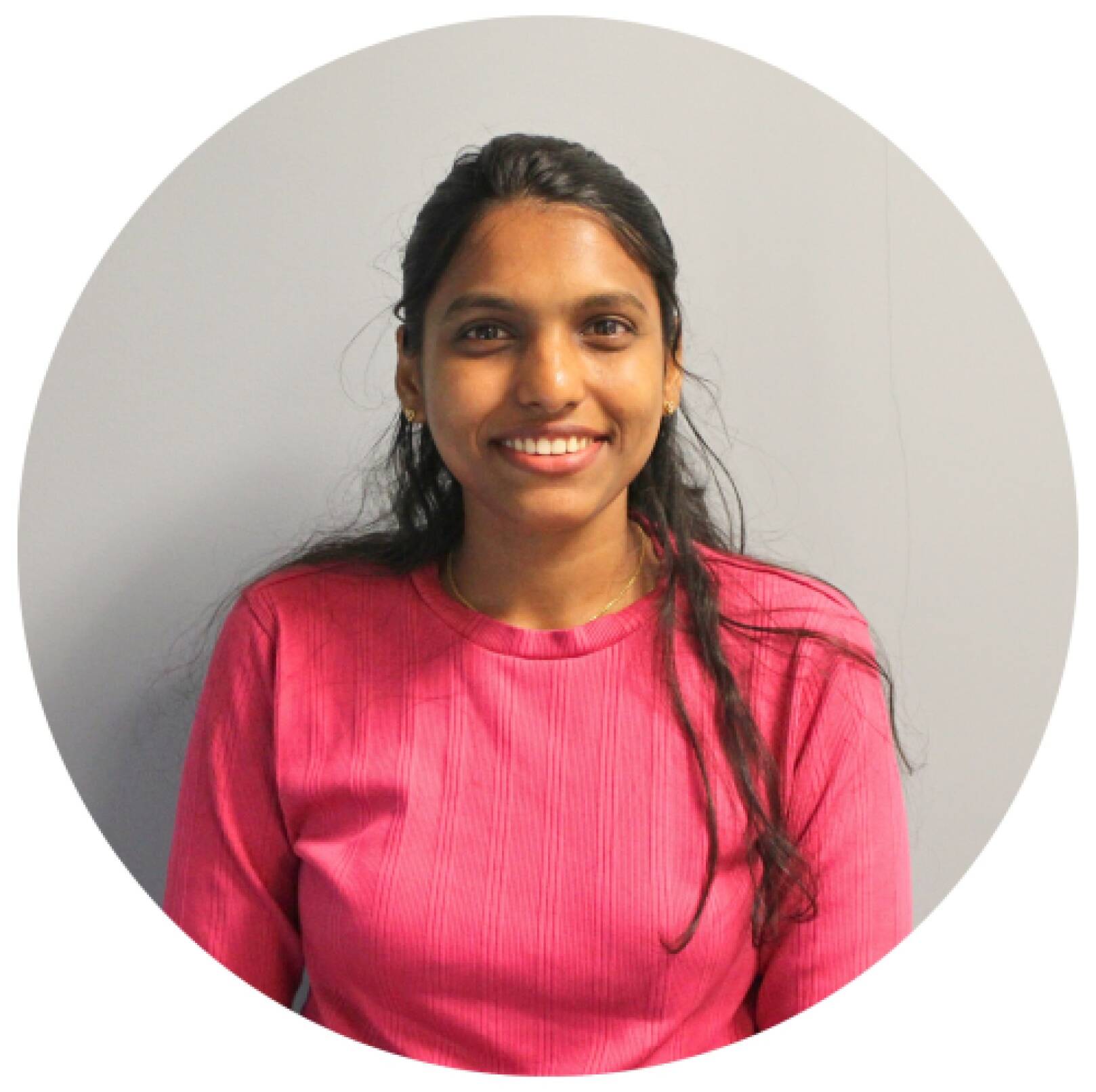 Usha Pedapalli smiling.